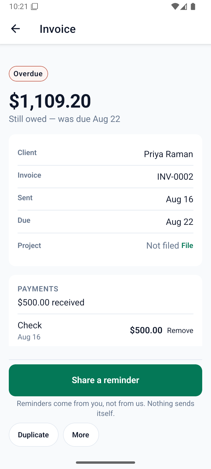 An invoice marked overdue, showing the amount still owed and a part-payment received by cheque